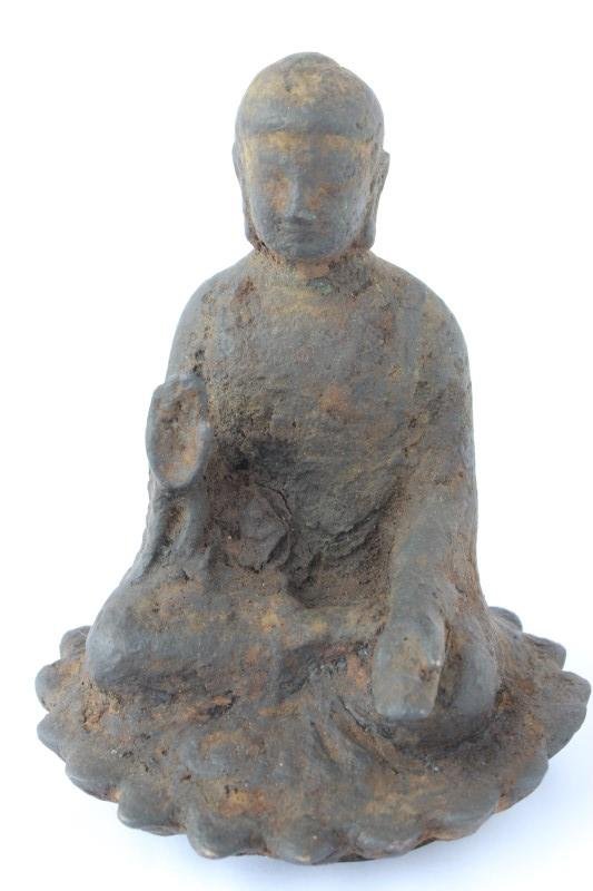 Early Cast Iron Buddha,: depicted seated in dhyanaana with one hand raised, the other open on lap, on a spreading lotus base, h 15cm