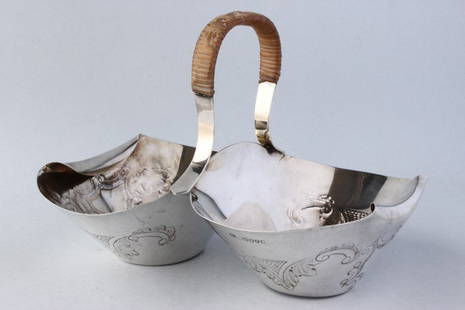 Late Victorian Sterling Silver Double Basket: hallmarked, London, 1880, Hukin and Heath, designed by Christopher Dresser, design no: 2223, with embossed c-scroll work to the body total weight 351gm, l 20cm