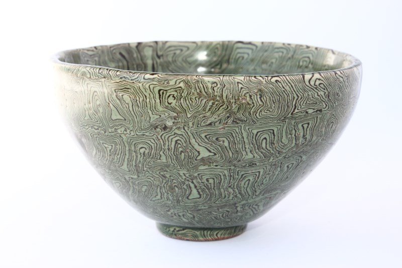 Chinese Pottery Bowl,: conical bowl raised on a small circular foot, with marbled green and brown glaze, d 12cm, h 7cm