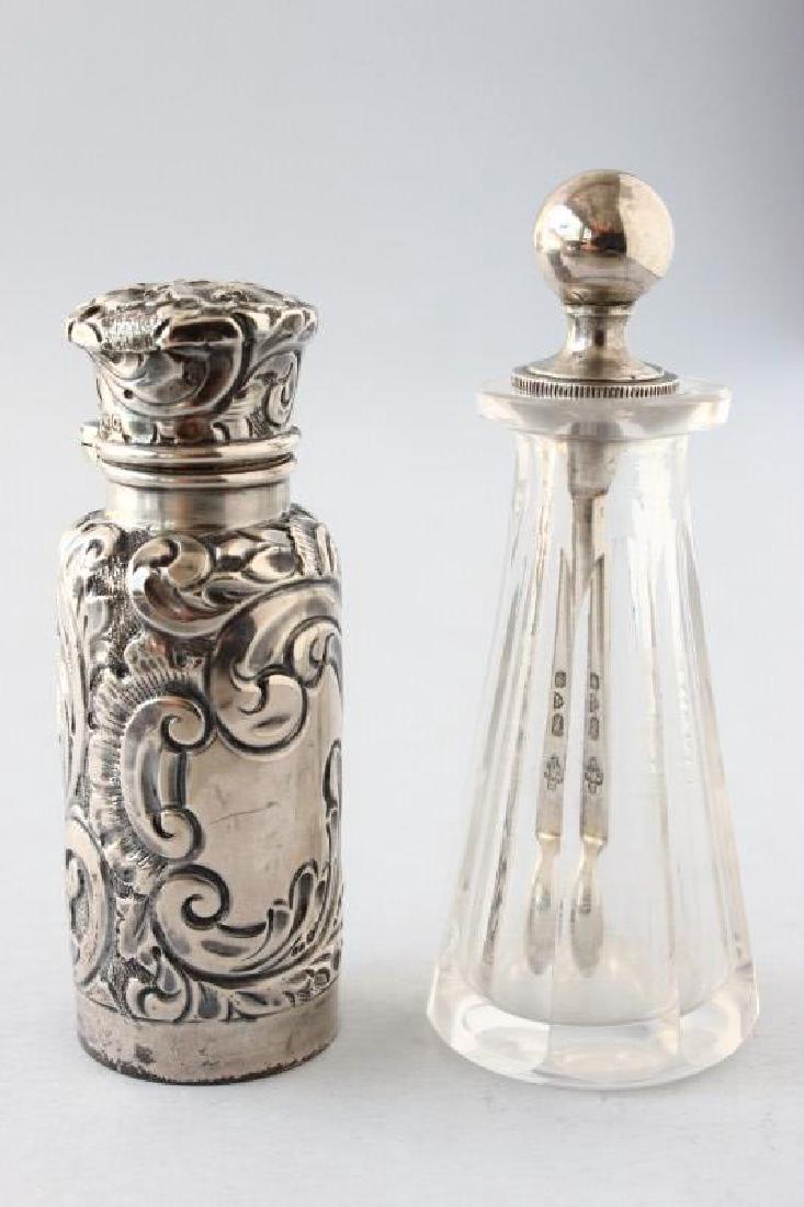 Two Chester Sterling Silver Scent Bottles,: the first hallmarked Chester, 1907, Jay Richard Attenborough, crystal body of cone form with everted rim, the small bowled silver spoon with long shank and bold ball finial above a flange to sit on th