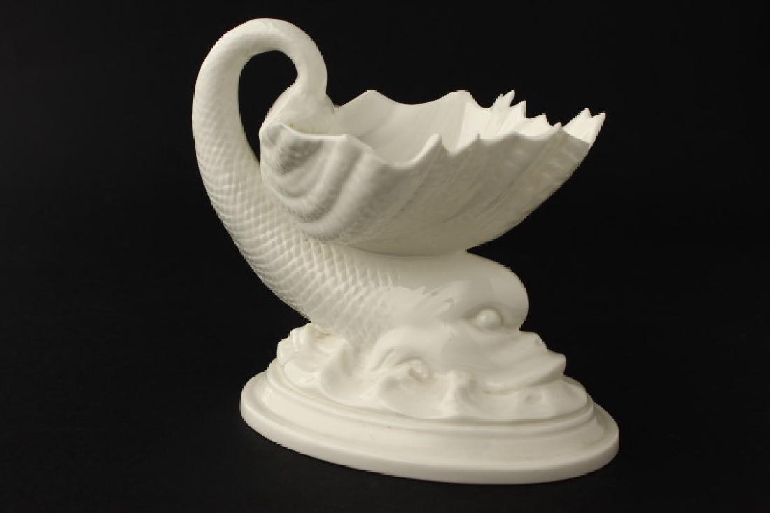 Royal Worcester Porcelain Salt Cellar,: of classical tastes, with shell salt supported on dolphin, on oval base, a/f, h 11cm
