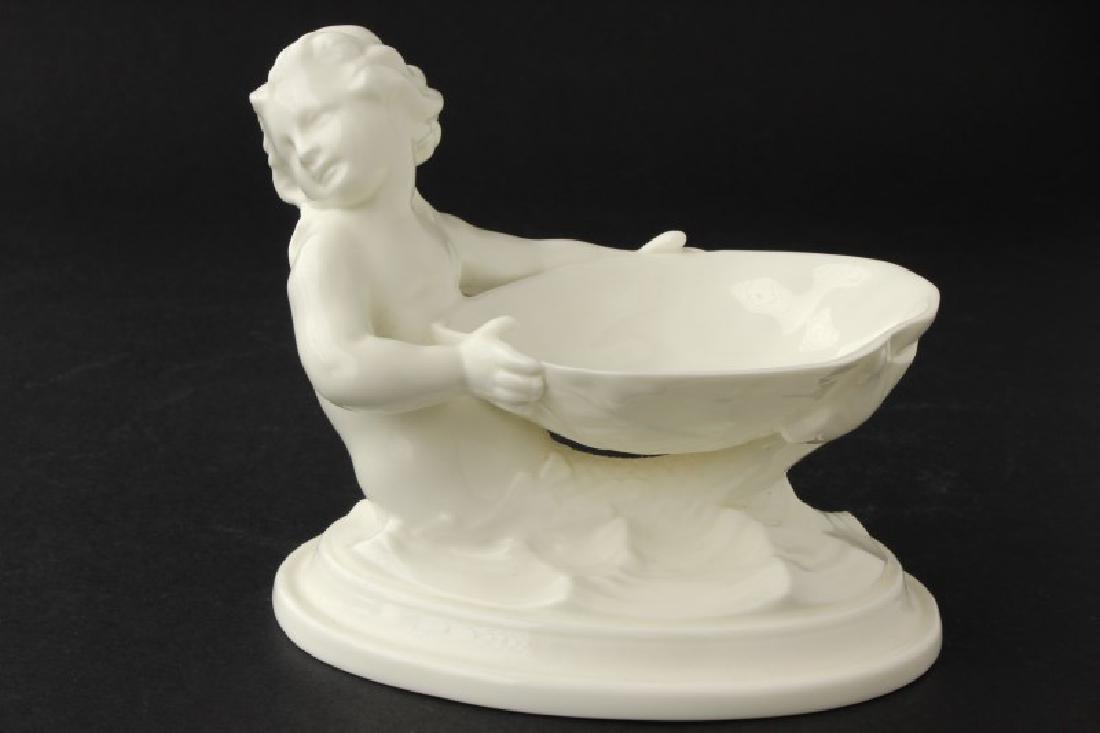 Royal Worcester Figural Salt,: in blanc de chine, the salt being supported by a mermaid, h 9cm