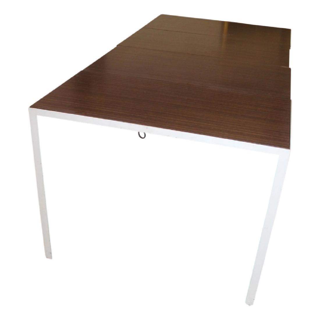 Florence Knoll Dining Table: Dining table by Florence Knoll. Wood lamnet top, with white metal frame. Adjustable extension table. Fair Condition (see photos for detail).