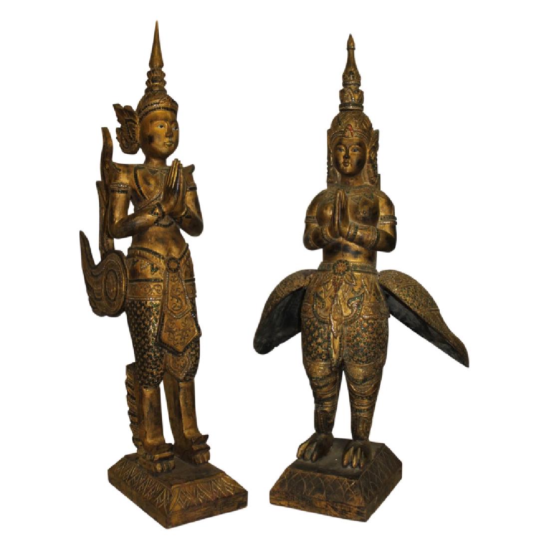 Pair of Large Antique Burmese Temple Gods: Set of two antique Burmese guilt wood statues of Temple Gods. Intricately carved detail. Original, with signs of age appropriate wear. 3 Feet plus.