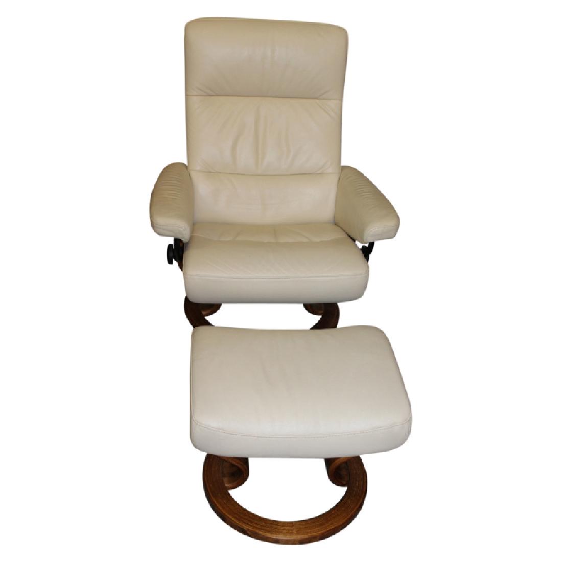 Scandinavian Modern Lounge Chair + Ottoman: Creme Scandinavian Modern lounge chair and ottoman. Lounge chair swivals and reclines. Ivory leather upholstery. Wood bases. Chair measures approximately 39" High, 29.5" Wide. The seat measures approx
