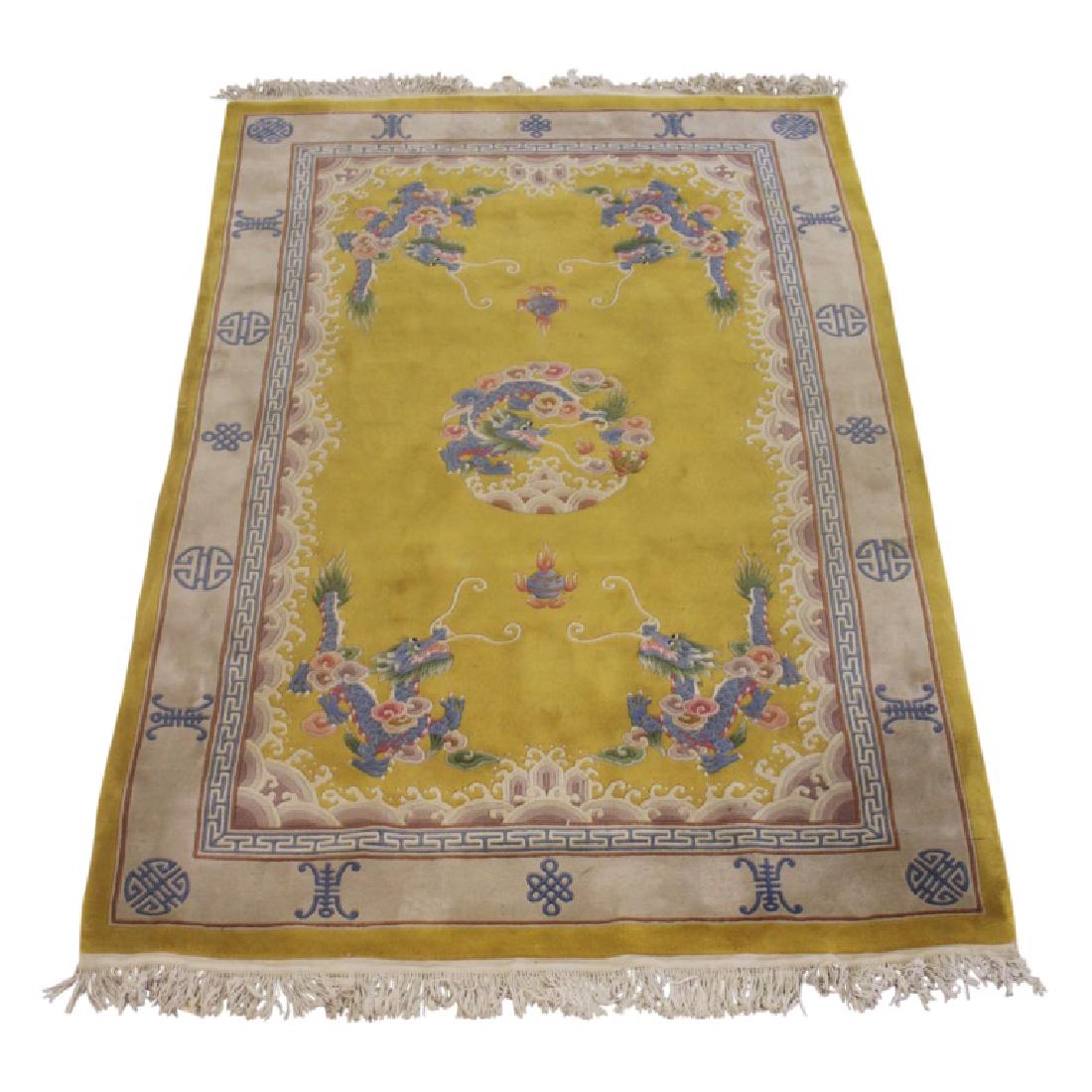Handmade Asian Carpet 302-4: Yellow with a tan border that has pale blue designs within it. Handmade. The design of the rug features long fringe on both ends and multi-colored Asian dragons. Measures approximately 116" Long and 7