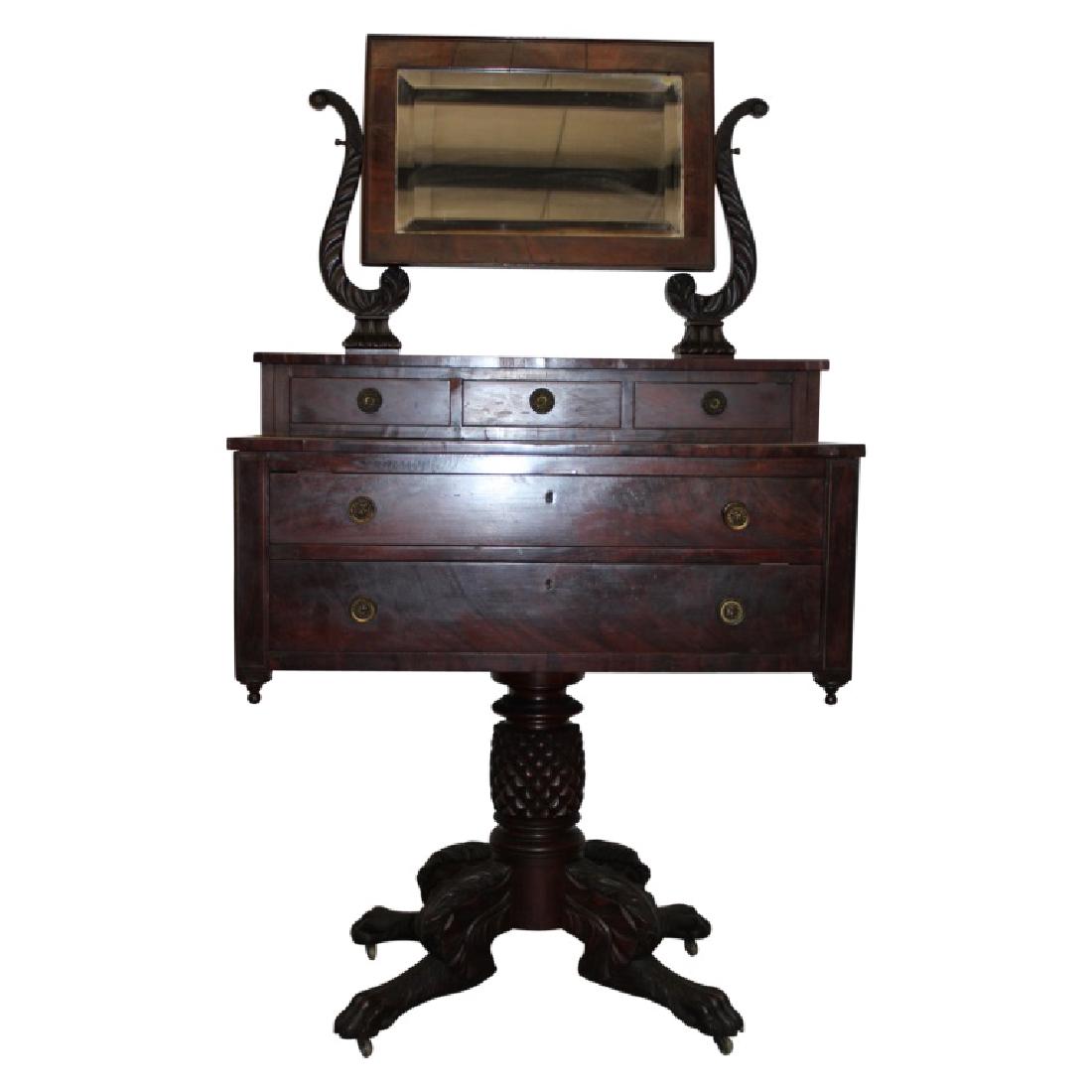Empire Classic Vanity: Classic Empire vanity featuring a beveled mirror and brass hardware. Ornate design. Made of Mahogany with Pine secondaries. Circa 1880's. New York origins. Measures approximately 64" High, 36.25" Long