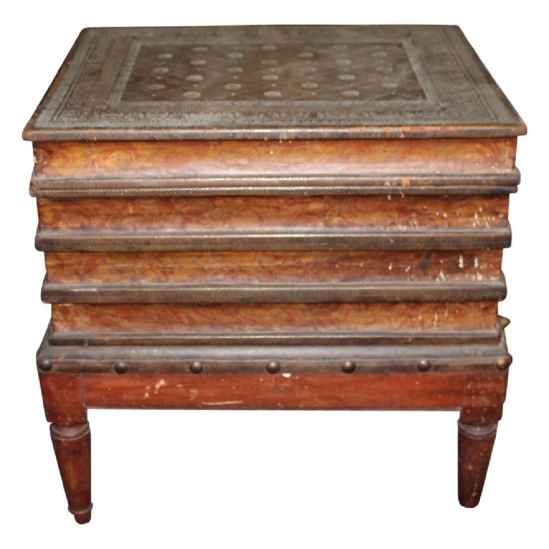 Wood Carved Book Stack End Table: Wood carved end table depicts a stack of books. Painted design. The piece is on legs. Circa 1950s. Italy origins. Measures approximately 17.5" High, 17.5" Wide 14" Deep. Good condition with a crack in