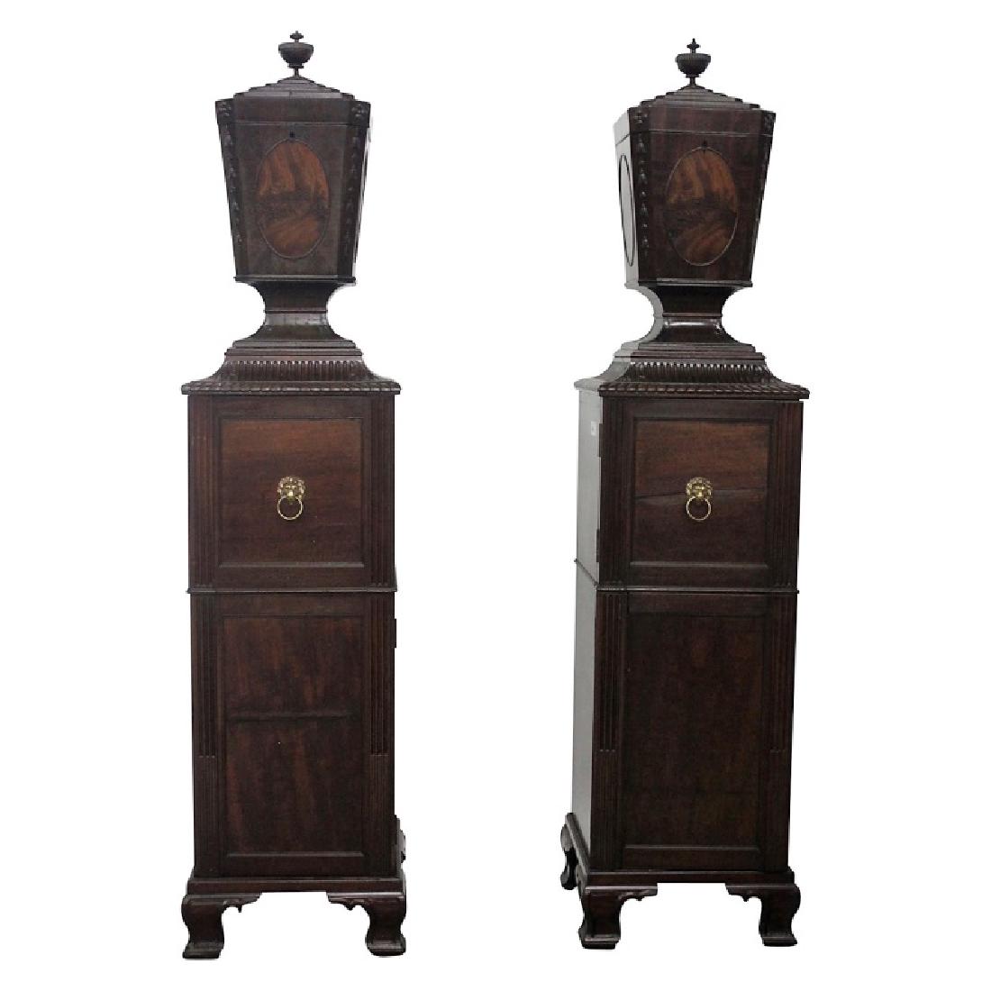 Pair Antique Adams Style Knife Boxes w/ Pedestals: Set of 2 Adams style knife boxes on form fitted mahogany pedastals. Made of crotch mahogany. The design features brass lionhead pulls. No inserts. One pedastal features a wine drawer. The other pedast
