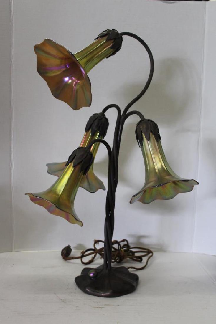 John Cook Studio Lily Lamp #424: Lily Lamp by John Cook Studio. This lamp features 4 favrile artglass iridescent shades and a bronze twisted base. Signed and numbered on the bottom of the base. Measures approximately 22.5" High and 1