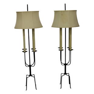 Pair of Tommi Parzinger Floor Lamps: Set of 2 Mid Century Modern wrought iron floor lamps by Tommi Parzinger for Parzinger Originals. Features four candle lights on each piece. Circa 1950's. Each piece measures approximately 60" High and