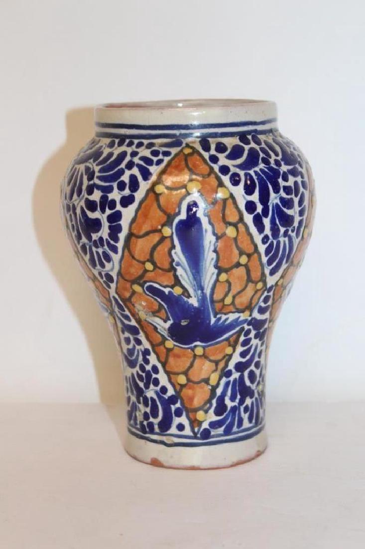 Middle Eastern Vase: White vase with blue and burnt orange designs. Middle Eastern origins. Measures approximately 6" High and 5" Wide. Good condition.