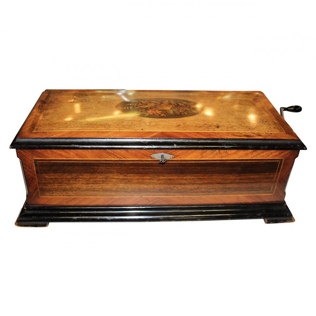 Antique Swiss Music Box Made in 1885: The Swiss made the finest music boxes, and here is no exception! Lovely piece! Beautiful Walnut with string inlay with magnificent medallion inlay. From a collector of music box's estate.