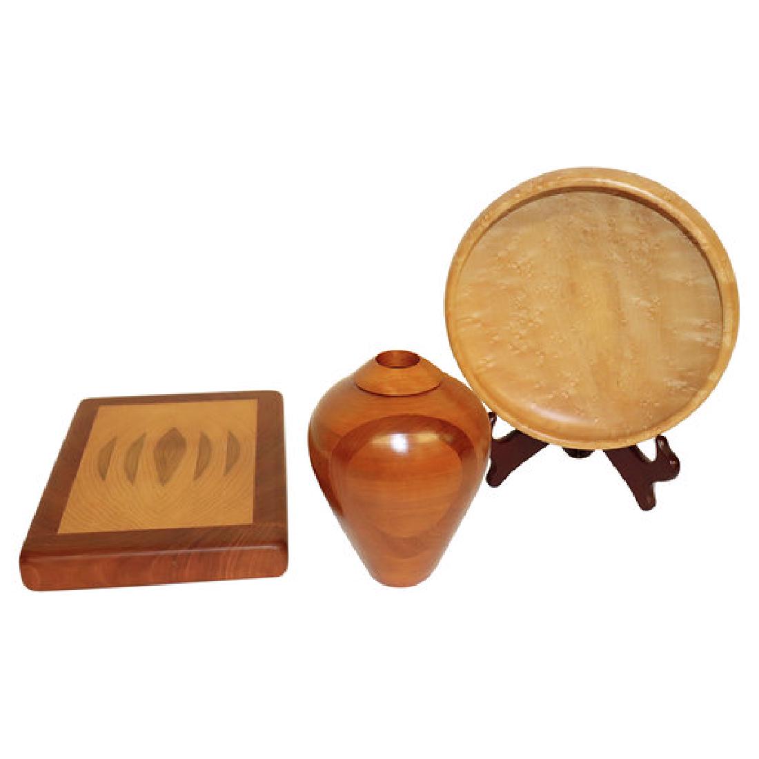 Three Handmade Wood Items Signed: Three handmade wood items: A vase by Robert St. Pierre, Hayesville, N.C., St. Pierre made wood potter. Measuring 7 inches by 4 inches, A wood cuttingboard signed Kendall measuring