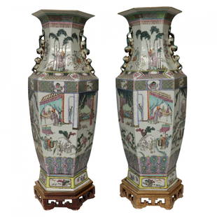 Pair of Chinese Porcelain Canton Famille Verte Vases: A fine pair of 19th century Chinese porcelain Canton famille verte vases, 19th Century. Each decorated with animals, houses and people; with a boy wearing an deer skin. Each measures 23 inches tall by