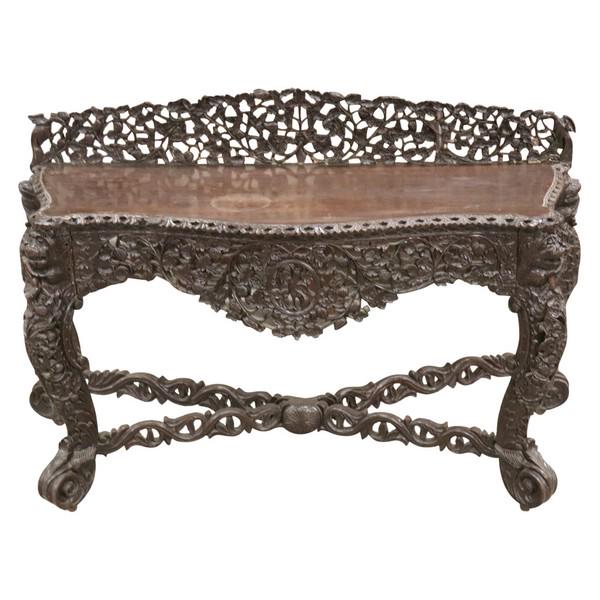 Rare Antique Asian Burmese Credenza: Burmese Carved Padouk Wood Console Table c.1850 measuring 53 inches wide, 21 inches deep, 30 inches to top and 37 inches to top of backsplash. Backsplash was cracked and professional reattached, two s