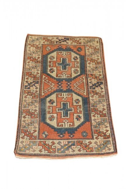 ANTIQUE KAZAK CARPET: Fine antique Kazak carpet. Measuring 31 x 50 inches. Good condition. Kazak rugs are a type of Armenian rug that were woven in the south of Caucasus. Good condition; faded.