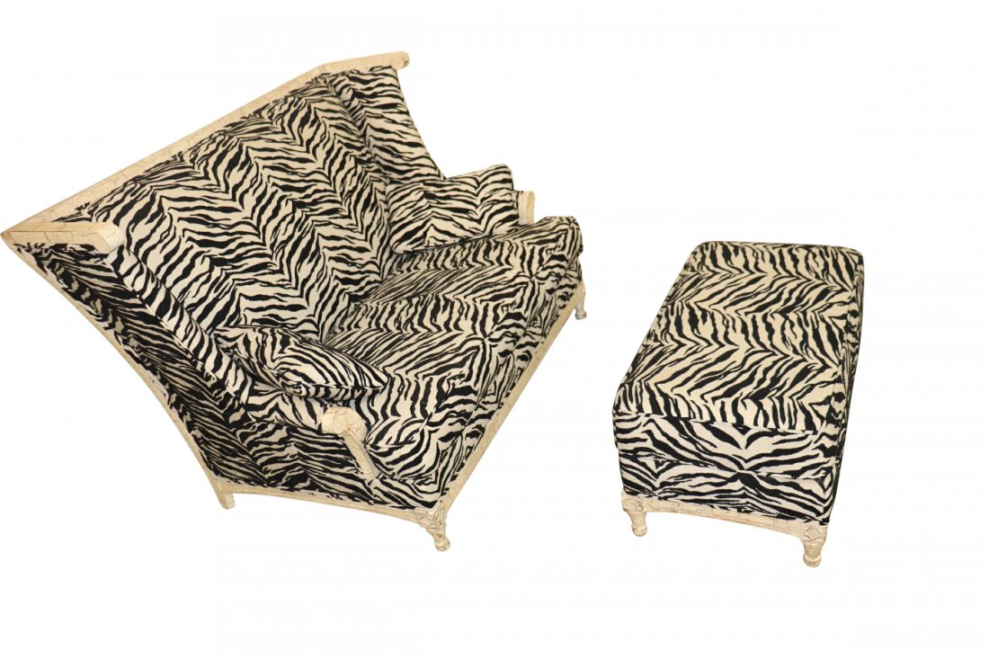 HIGHBACK ZEBRA PRINT SETTEE AND OTTOMAN: Large high-back settee with a zebra print and beige crackle finish frame. Measuring 59.5 inches wide x 42 inches high x 36 inches deep with the ottoman measuring 36 x 20 x 16 inches. Very good conditi