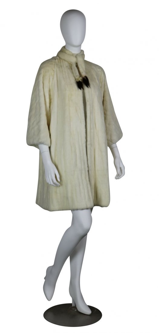 EXQUISITE BERGDORF GOODMAN WHITE ERMINE FUR COAT: Exquisite Bergdorf Goodman white ermine fur coat with small tail accessory. Measuring shoulder to should 16 inches, shoulder to wrist 19 inches, total coat length is 36 inches. Hand stitched Bergdorf 