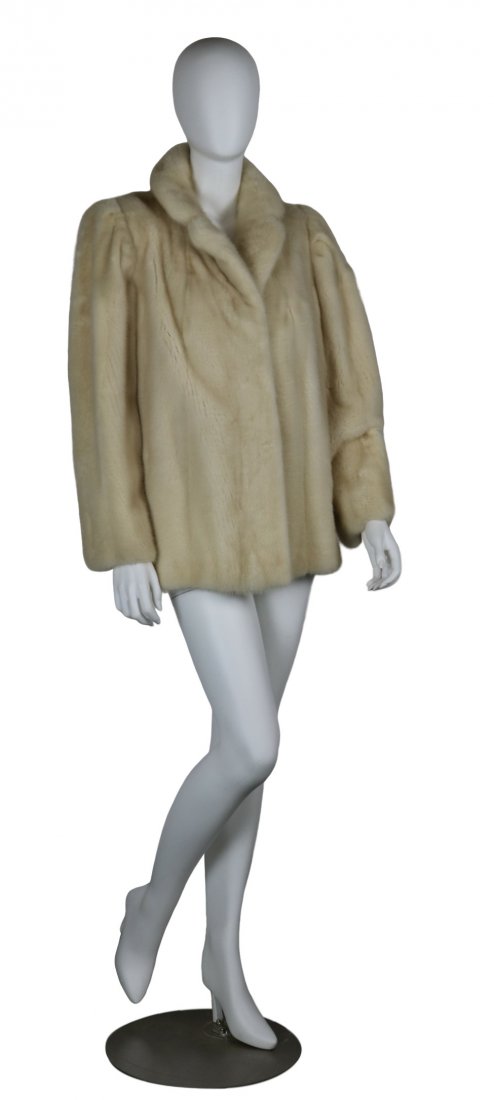 WHITE MINK JACKET: Beautiful white mink jacket measuring shoulder to should 18 inches, shoulder to wrist 25 inches, total coat length is 28 inches. Label reads Strawbidge Clothiers. Fine condition.