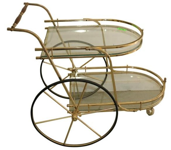 MODERN TEA CART BRASS AND GLASS: Modern brass and glass tea cart. Measuring 33 inches tall by 21 inches wide and 37 inches deep. Good condition.