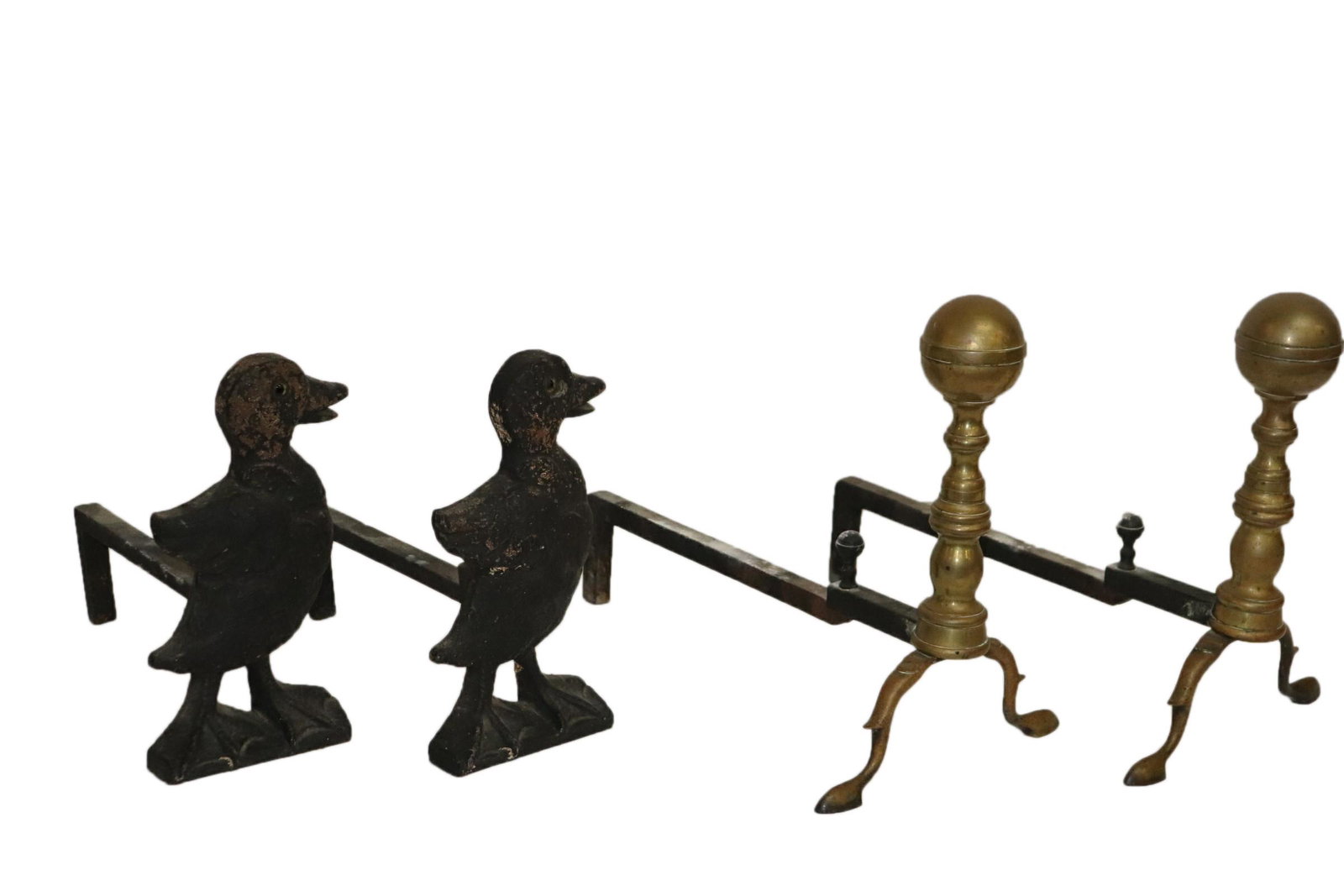TWO PAIR ANTIQUE ANDIRONS DUCKS AND CANNON BALL: 2 pairs of antique andirons one pair being brass with a turned shaft and cannon ball tops the other being iron in the form of ducks. Measuring Ducks at tall width depth, Cannon balls measuring tall wi
