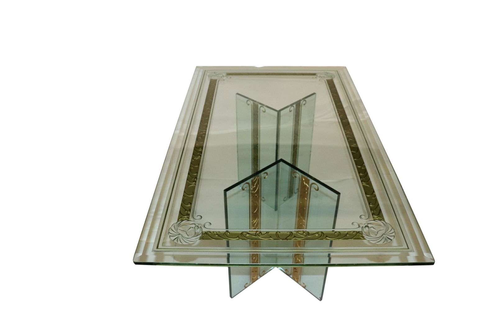 EXQUISITE ETCHED GLASS DINING TABLE: Exquisite etched glass dining table attributed to Tomlinson with gilt lion decoration. Measuring 42 inches wide by 72 inches long and 29 inches high. Small chip to base corner support and minor surfac