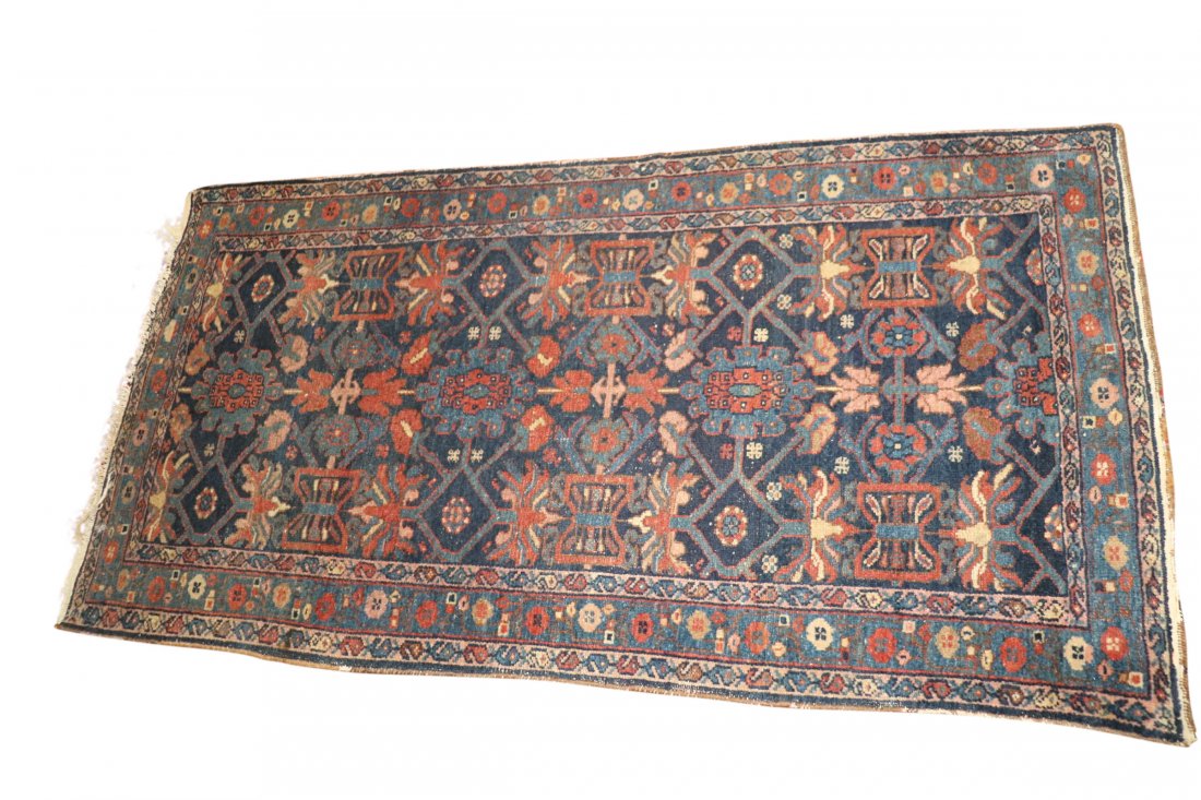 PERSIAN HAND WOVEN THROW CARPET RUG: Hand woven persian carpet geometric pattern over-all blue field. Measuring 2 feet by 6 feet. Good condition.