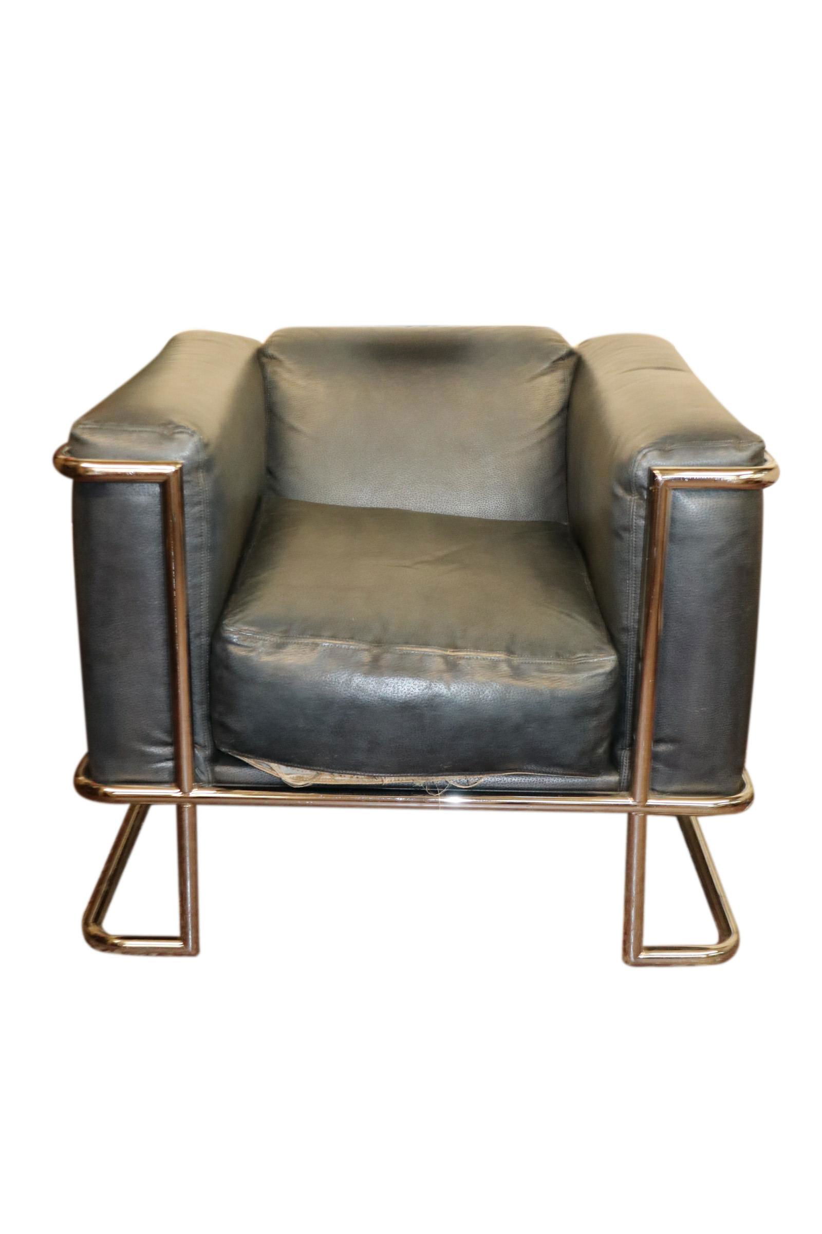 LE CORBUSIER STYLE LOUNGE CHAIR: Le Corbusier style lounge arm chair with blue/gray leather upholstery. Measuring 25 inches wide by 31 inches deep and 31 inches tall with the seat measuring 18 inches wide by 22 inches deep and 12 inc