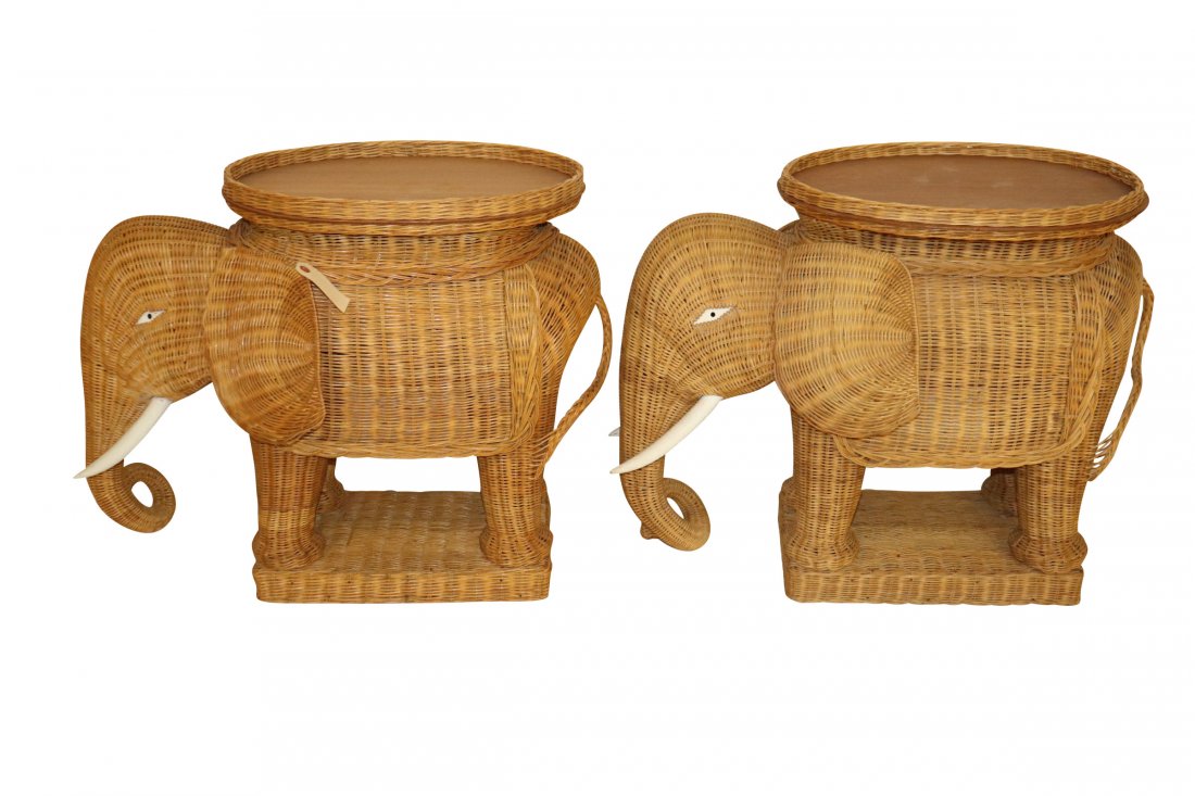 PAIR OF VINTAGE RATTAN ELEPHANT END TABLES: Pair of vintage (1970's) rattan elephant form end tables measuring 32 inches wide by 24 inches tall and 15 inches deep with their servingh trays. Minor losses.