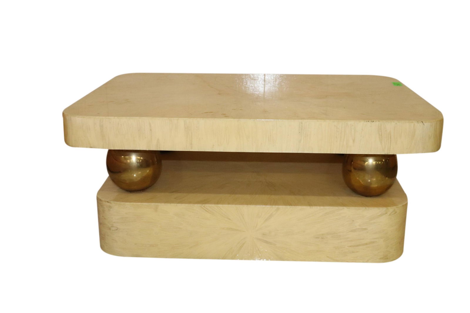 KARL SPRINGER STYLE VINTAGE LACQUER & BRASS COFFEE: Vintage lacquer goat skin and brass sphere support coffee table attributed to Karl Springer measuring 36 inches wide by 16 inches tall and 26 inches deep. Good Condition.