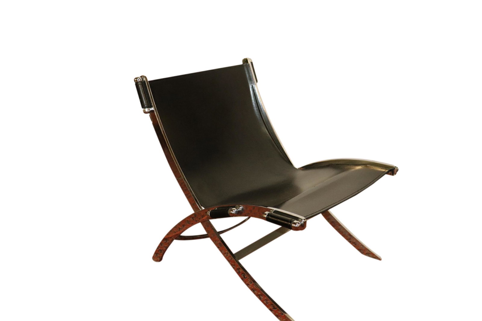 PAUL TUTTLE LEATHER AND CHROME SLING CHAIR: Vintage Paul Tuttle black leather and chrome sling chair measuring 30 inches tall by 25 inches wide and 29 inches deep. Good condition.