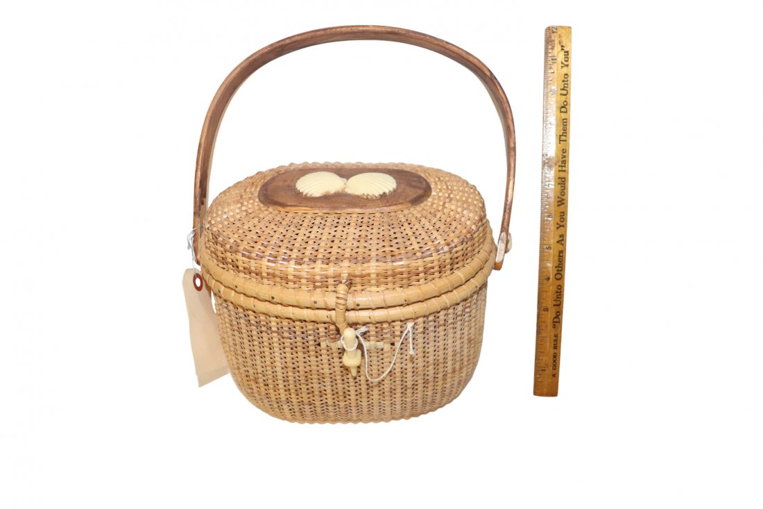 R.L. Webber Nantucket Seashell Basket: R.L. Webber Nantucket basket with 2 Seashell Motif Lid Latch Handled Basket. Measures 7 x 9 x 7 inches. Bone closure needs attachment. Please see photos. Overall in good condition