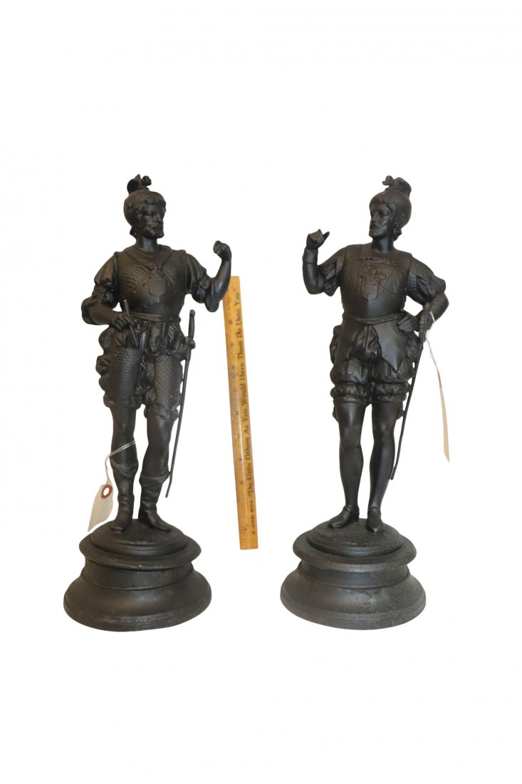 Pair of Black Metal Statues: Pair of black metal statues, men with swords. Thumb on one of the statues looks damaged. Please see photos for more details. Overall good condition. Measuring 15x3 inches. Please refer to photos for d
