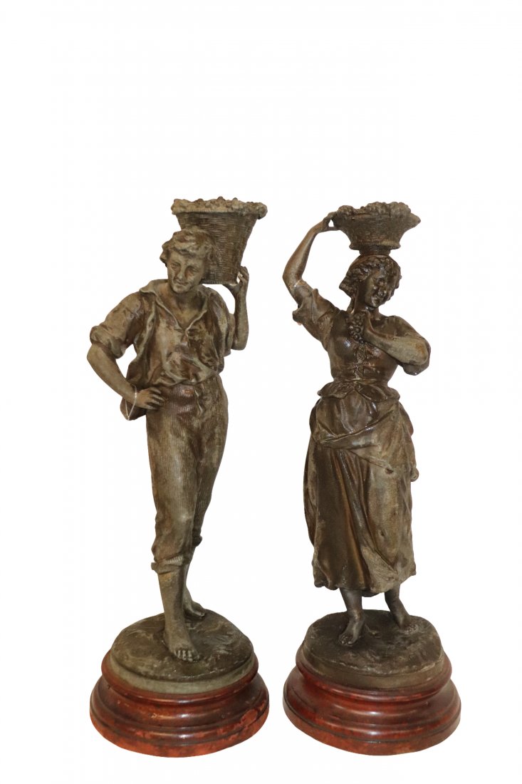 Pair of Tall Peasants: Nice pair of tall peasant statues. Metal with wood bases. One base has hole for lamp pole. Overall good condition. Measuring 20x7 inches. Please refer to photos for details