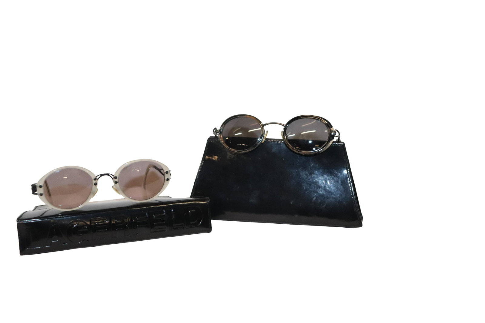 Lagerfeld Designer Eyewear: 2 piece lot of Lagerfeld designer eyewear. Comes with 2 great patent leather cases. Change out lenses and have 2 pair of designer eyewear. Please review all photos posted for this listing. We encourag