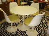 Eero Saarinen for Knoll DR Table & 4 chairs: Eero Saarinin for Knoll 36" round pedestal dining table with white laminate top and four tulip chairs with original Naugahyde seats, circa 1960's (Model BR51) Knoll Label.