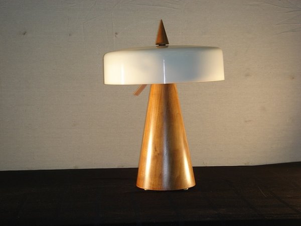 Phillip Lloyd Powell table Lamp: Table Lamp by Phillip Lloyd Powell.Carved one piece walnut cone shape with white opague glass shade. Overall height: 21" Width of wooden body 7 inches Lamp Shade: 13 inches diameter.