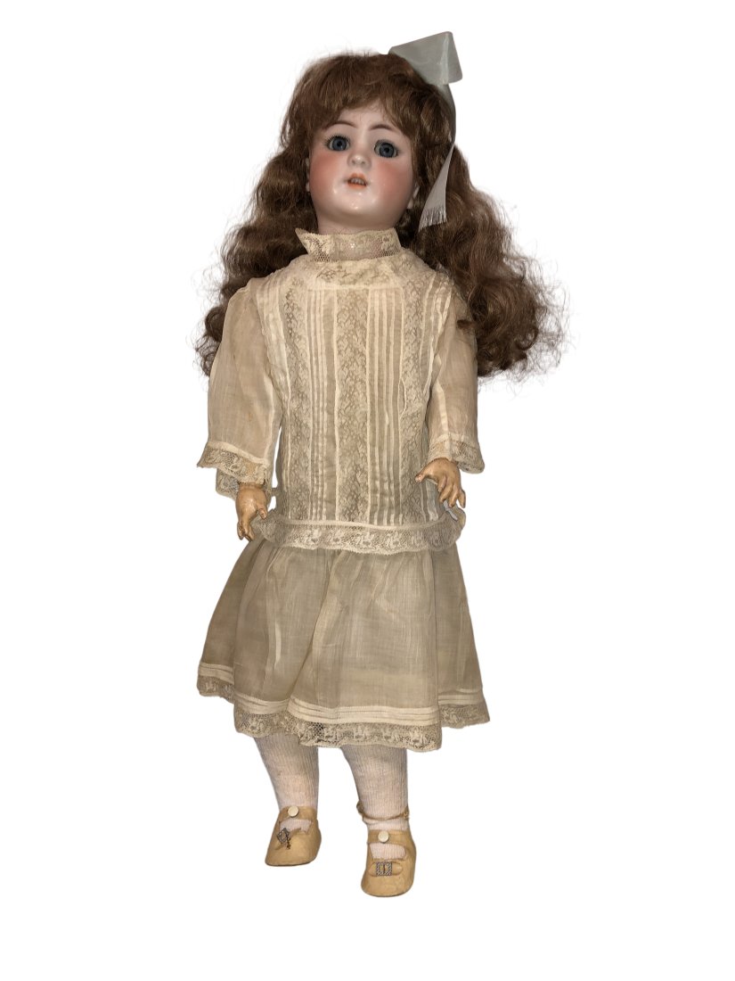 Antique Simon & Halibug Bisque Doll: Beautiful S&H Doll. Blue Eyes, Antique Clothes. Bisque & Compo body. Eyes open and close. Eyelashes are painted on. These dolls are from a personal collection from a local estate. They were collected