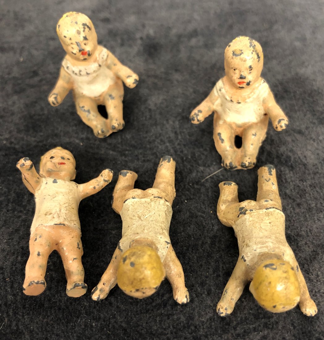 Collection 5 Miniature Lead Baby Figurines: Collection 5 Miniature Lead Baby Figurines These dolls are from a personal collection from a local estate. They were collected over last 60 years from all over the United Sates. Smoke Free, Pet Free e