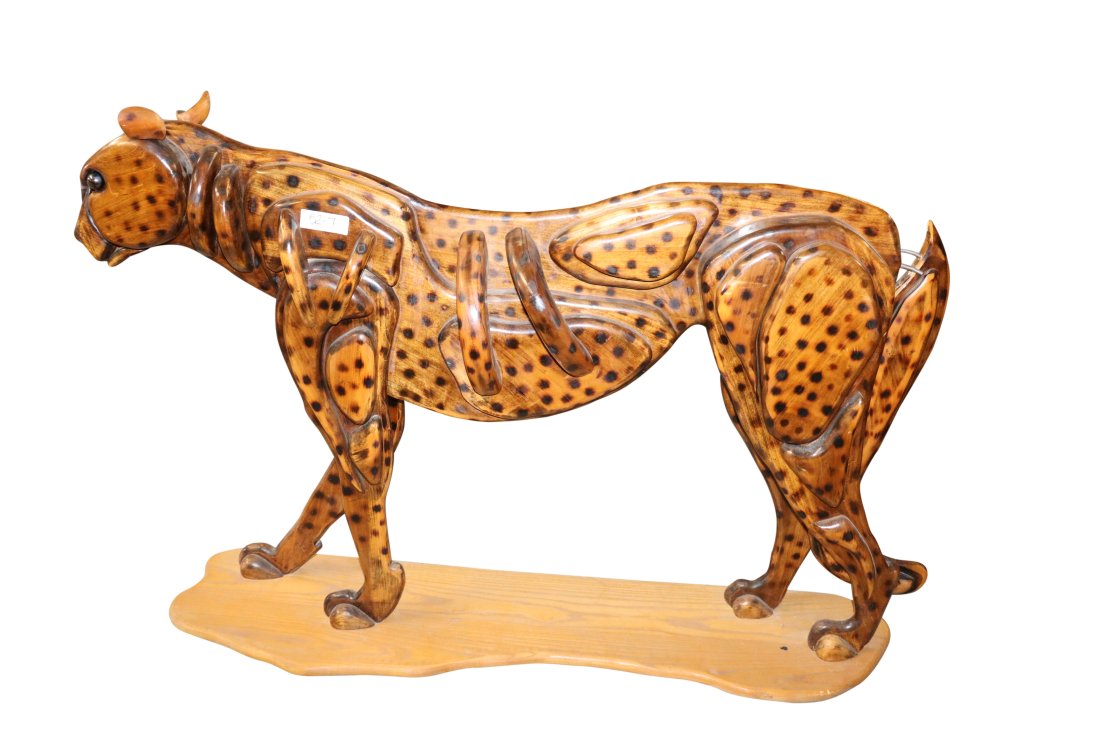 Life-size Wood Cheetah on Stand: Very Detail Wood hand Painted Cheetah on wood stand. Looks to have been converted in back to rack of some kind. Tail is on spring Dimensions: 53.5 inches wide x 34 inches high x 12 inches deep Conditi