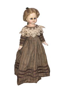 Wax Over Porcelain Doll: Wax over Porcelain with leather and cloth body. Pretty brown Victorian dress These Dolls come from a local estate. Her collection spans over 50 years and dolls from all over the world. Dimensions: 15