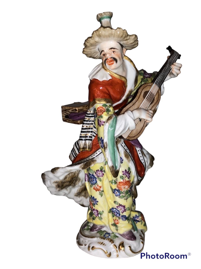 Malabar with Mandolin Meissen Crossed Swords: Malabar with Mandolin . Crossed swords Meissen. No visible cracks or major chips. One small flea bite on hat. please see picture Dimensions: 7.25 inches high x 4.5 inches wide x 3 inches deep Conditio