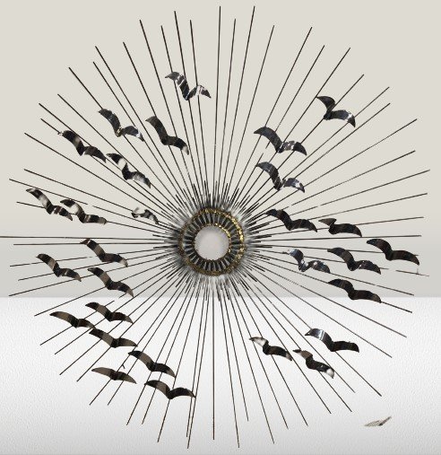 Brutalist Radial Sunburst Birds in Flight Wall Sculpture: Brutalist Curtis Jere Style Metal Wall sculpture. Sunburst with birds in flight Dimensions: 40.5 inches in diameter Condition : Expand photos to see additional details. For more information or conditi