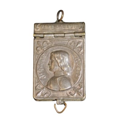 Antique LaVie De Joan of Arc book locket: Miniature brass book hinged locket with a fold series of photos Cover shows a raised image of Joan of arc Fleur de Lee corner pieces ——the rear shows dates at the top, and central Lily, crowned sw
