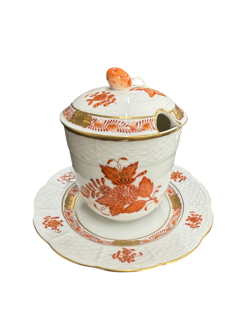 Herend 4" Jam/Jelly & Lid w/Attached Under plate: Herend Jam/Jelly & Lid w/AttachedUnder plate. A popular design since the 1930s. Hand-painted in Hungary with a stylized peony and garland of leaves.Features 24-karat gold accents.