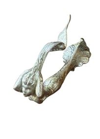 "Flying Goddess" or "Flying Lady" Cadillac hood ornament.