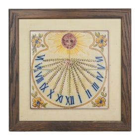 A hand-painted antique sundial ceramic tile mural