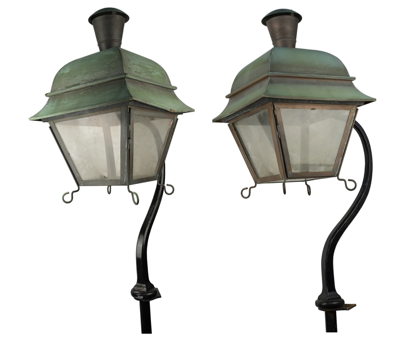 Carriage House Lanterns Green Patina: Pair of Carriage House Lanterns with Green PatinaThese carriage house lanterns originate from a historic building on Walnut Street in Philadelphia. They are characterized by a distinctive curved arm m