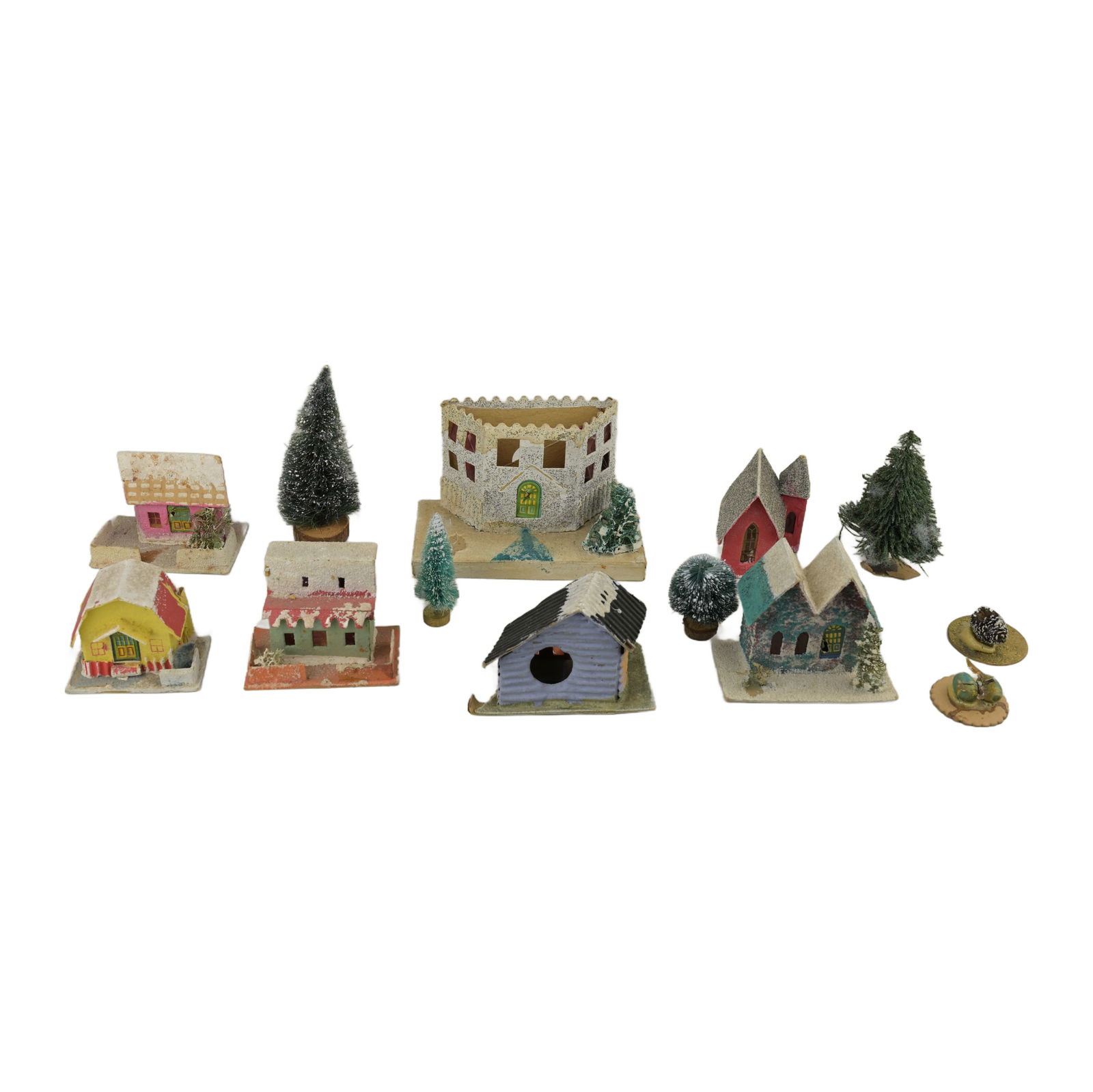 Vintage Mid-Century Modern Putz Houses: A collection of miniature Christmas Putz houses crafted from cardboard, adorned with snow and glitter. These houses constitute a larger collection of Christmas village scenes. Each house possesses a s